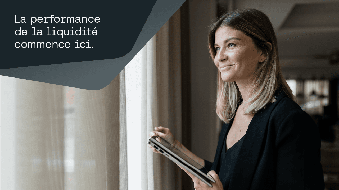 Woman looking out window with liquidity performance on tablet