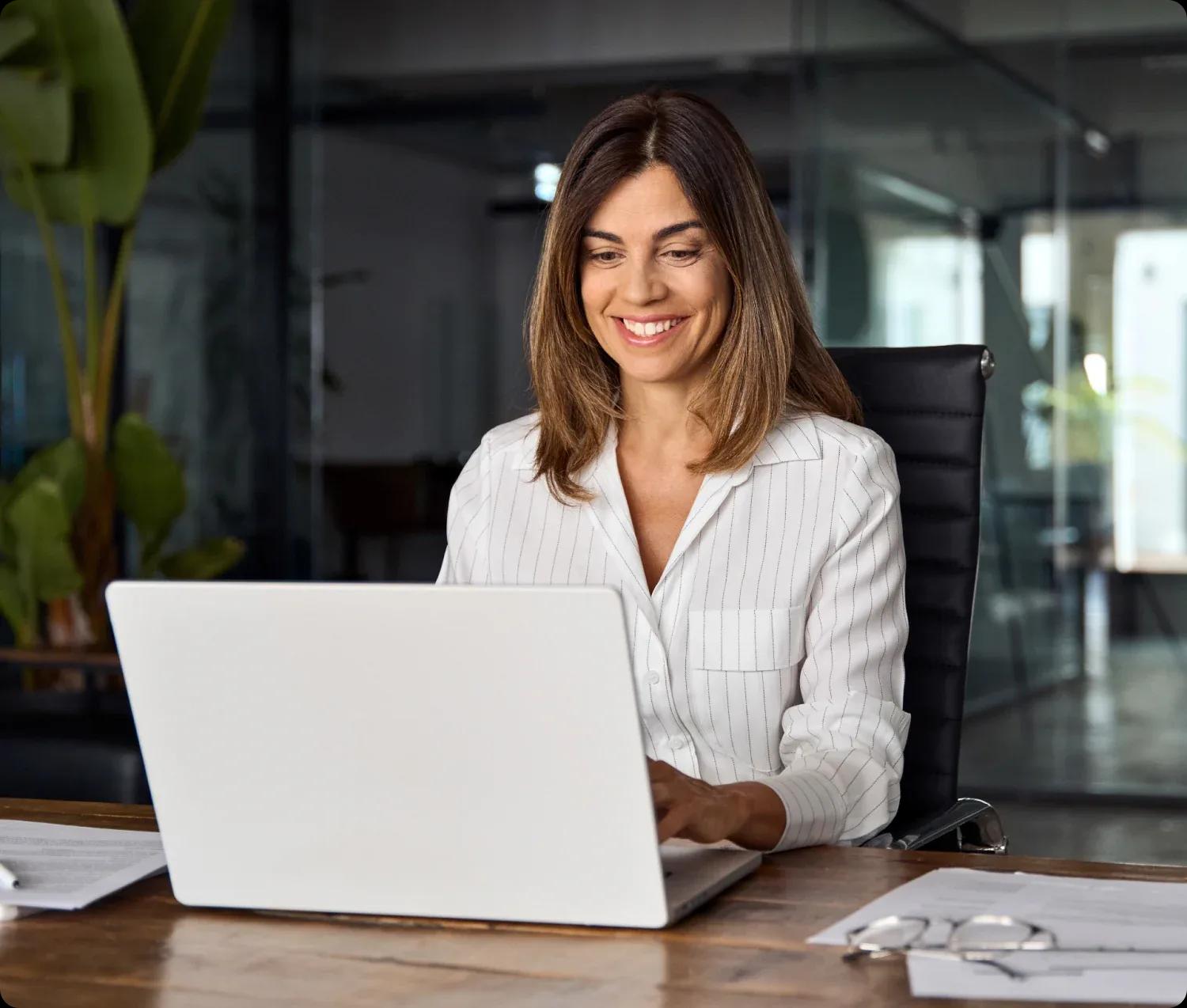 Image of a treasury manager working on her laptop